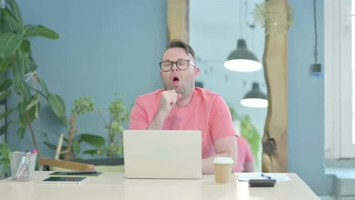 Adult Working on Laptop at Workplace