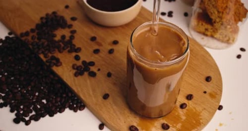 Refreshing Iced Coffee Drink with Brown Coffee Beans