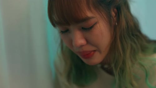 4K Close up of Young Asian woman sitting in bedroom and crying.