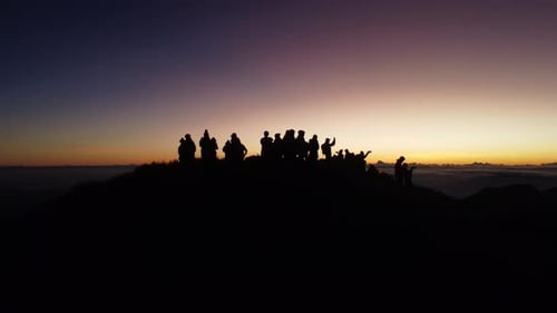 Aerial video of Mount Pulag at sunset with people in the background, the third highest mountain