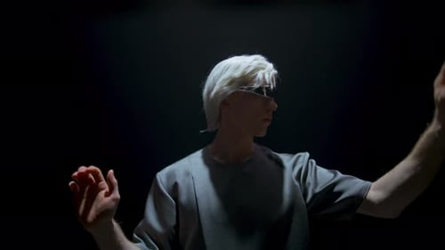 Futuristic Young Adult Interacting with Digital Interface