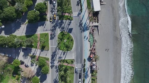 Aerial Video Vehicles Moving Along the Coastal Highway with Stunning Views of the Mediterranean Sea