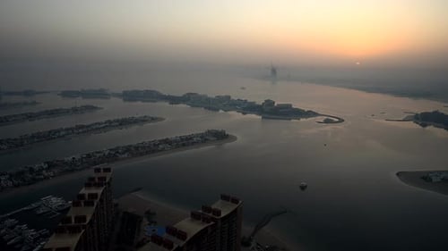 Aerial View of Beachfront City at Sunset