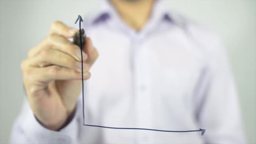 Man Drawing Graph Showing Economic Crisis