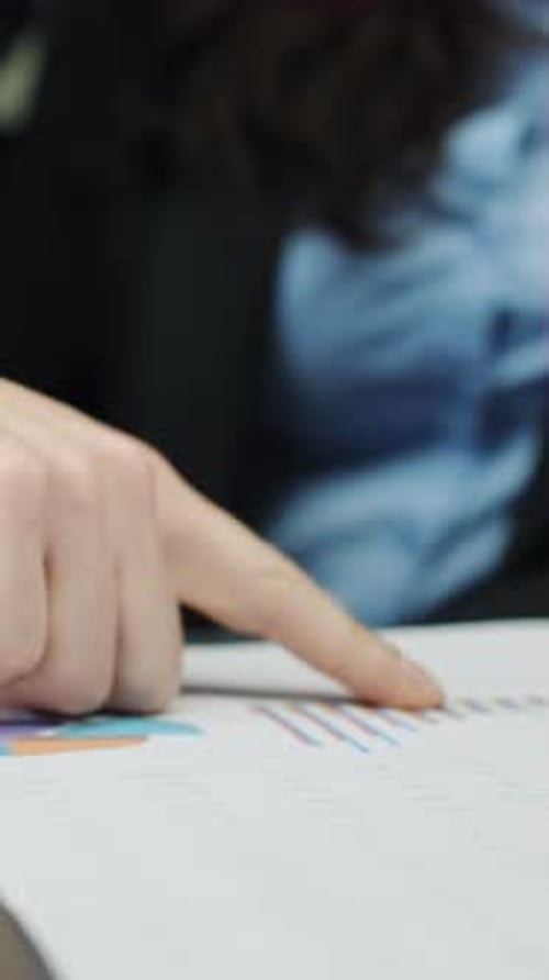 Vertical Screen Hands of Business People Working with Papers and Checking Graphics