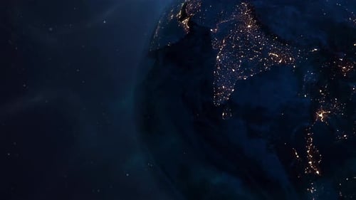 Planet Earth Rotating at Night with Glowing City Lights