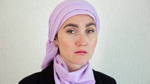 Muslim Woman Wearing Pink Hijab Looking with Depression
