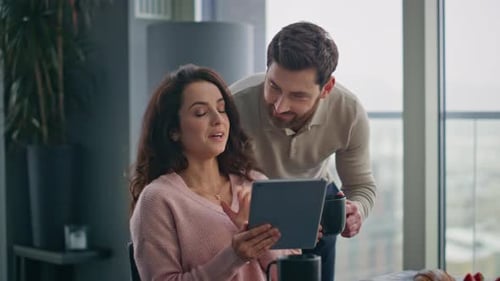 Happy Newlyweds Looking Tablet Screen Resting Home Closeup Love Pair Discussing