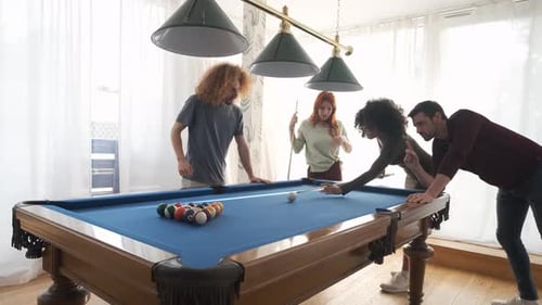 Black Woman Successfully Hitting Pool Ball