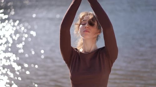 Woman Doing Yoga by Sparkling Water