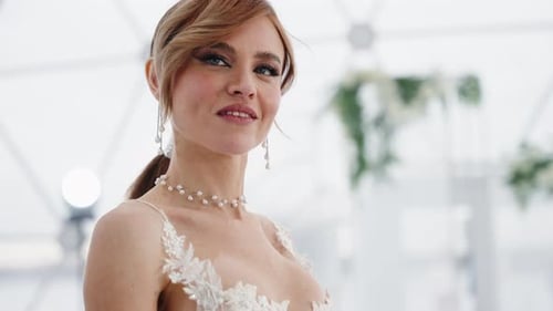 Auburn Haired Woman in White Dress Smiling