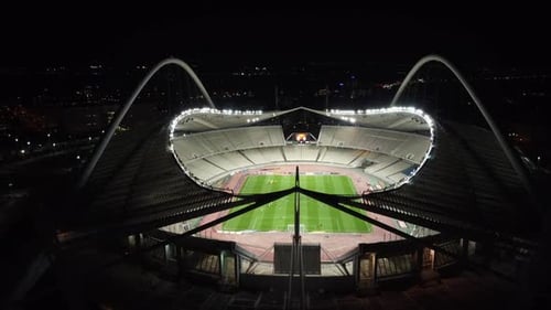Aerial footage of an olympic stadium OAKA in Athens by Night