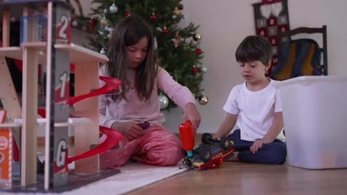 Children Play with Toys Near Christmas Tree Indoors