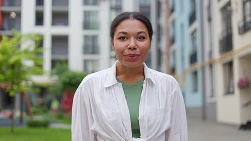 African American Woman Standing Outside the Street with Wow Emotion