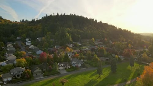 4K Aerial Drone fly toward wooded forest hill near Portland, Oregon in autumn.