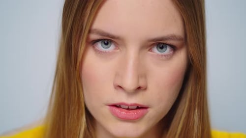 Close Up of Young Woman Looking at Camera