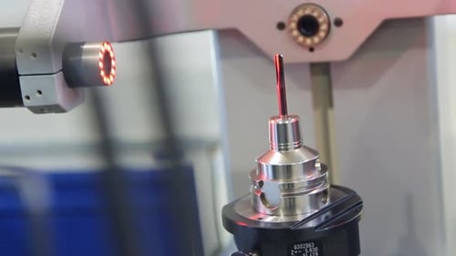 Automated Measurement Machine in Action at Factory Workplace