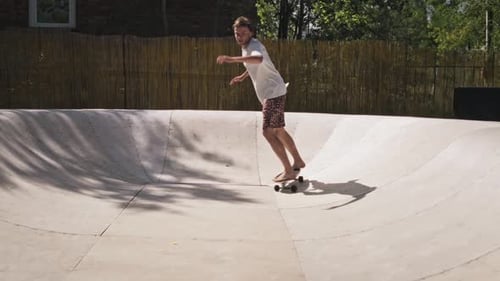 A Cool Guy Rides in a Skate Park on a Skate Surf A Skilled Young Man is Free to Skateboard