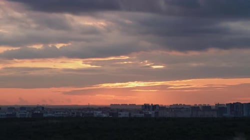 The sun slowly descends below the horizon, painting the sky with a kaleidoscope of colors.
