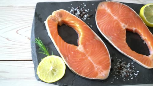 Fresh Raw Salmon Steaks with Lemon and Rosemary