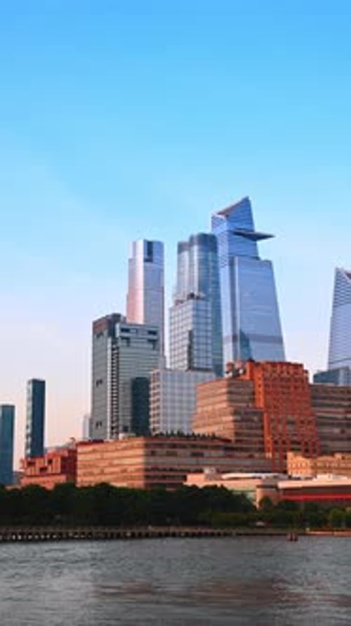 Green park at the East River waterfront. Watching the stunning buildings of New York from the boat.