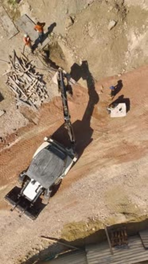 Vertical Video Aerial Transformation View of Tractor Prepping Land for Residential Complex