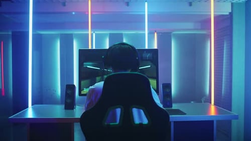Gamer wins video game in neon-lit room
