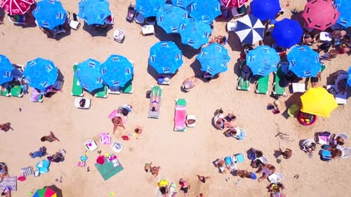 Mediterranean beach during summer with people in the water