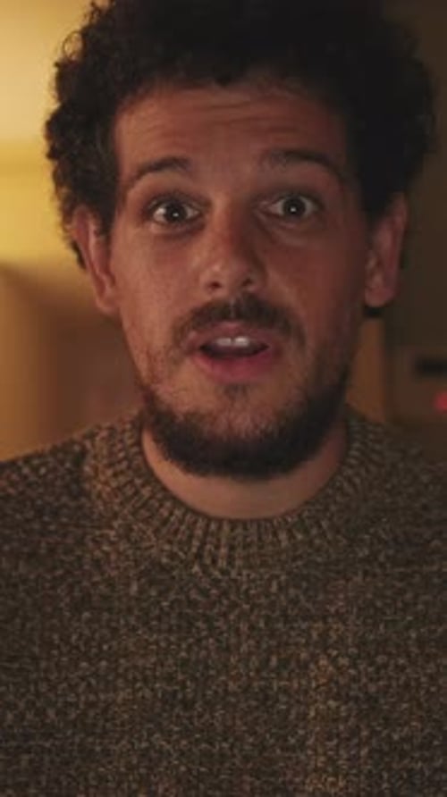 Man Talking and Gesturing Indoors in Close Up