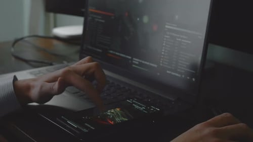 Adult Hands Using Smartphone and Laptop on Desk