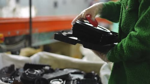 Side View Unrecognizable Young Woman Placing Black Plastic Trash in Box in Slow Motion Female