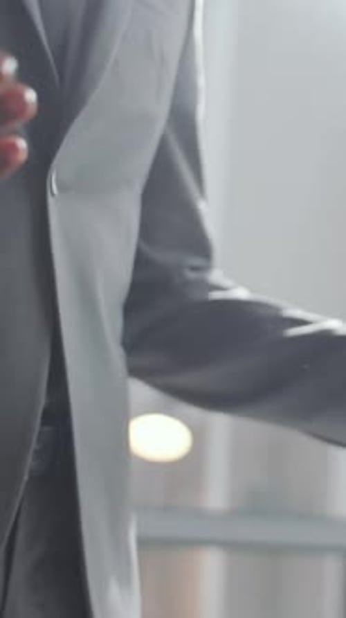 Close-Up of Two Business Partners Shaking Hands and Having Discussion