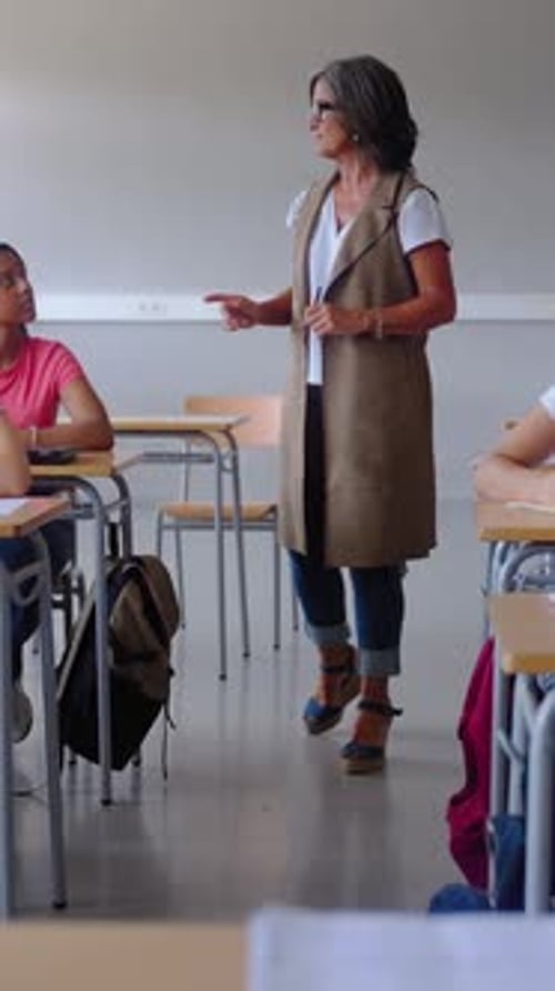 Teacher Lecturing Students in Classroom
