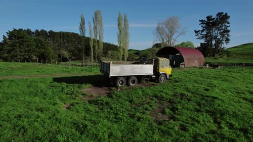 Rotating aerial view of a farm truck, used for agricultural purposes such as transporting feed.