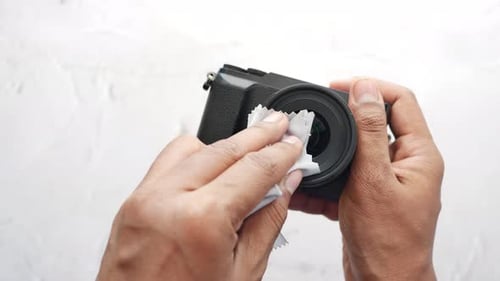 Top View of Cleaning a Camera Lenses with a Cleaning Cloth