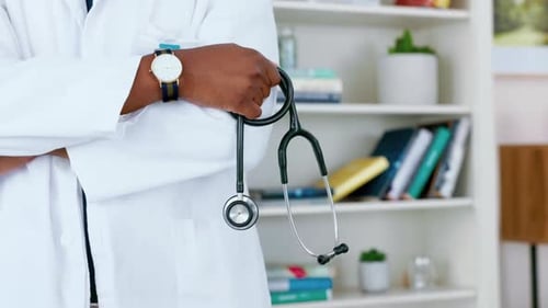 Doctor Holding Stethoscope in Office Setting