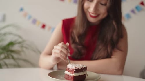 Enjoying a Slice of Birthday Cake at a Party