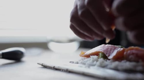 Sushi Preparation with Salmon and Avocado