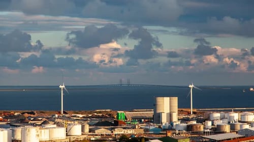 Timelapse of Copenhagen Industrial Area with Oresund Bridge and Wind Farm