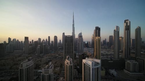 Aerial view of cityscape with skyscrapers at sunset, United Arab Emirates.