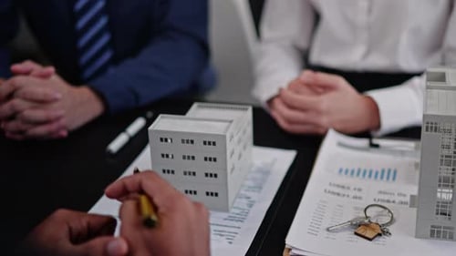 Businesspeople sell buy mortgage and signing agreement for apartment financial