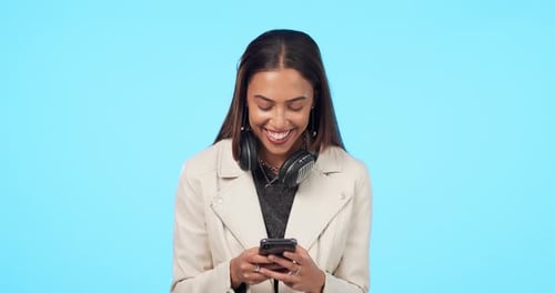 Happy woman, phone and texting in studio, laughing and reading funny email