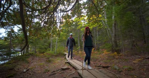 Hiking Couple in Forest Lake Landscape
