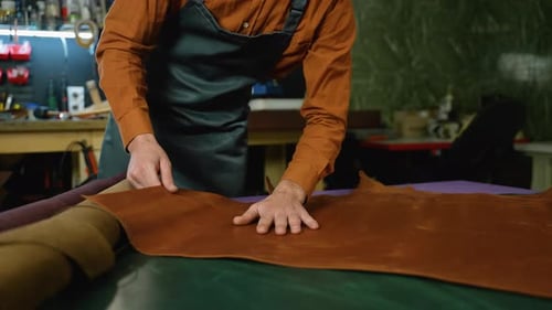 Craftsman Working with Leather in Workshop