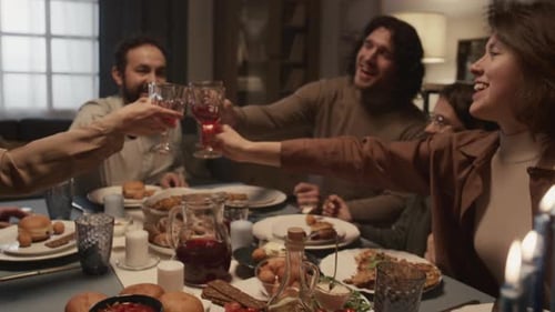 Family Celebrates Hanukkah with Candles and a Toast