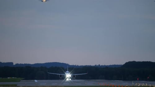 Airplane Taking Off from Runway at Night