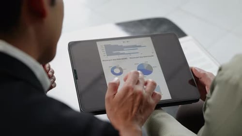 businesspeople working and brainstorming in office