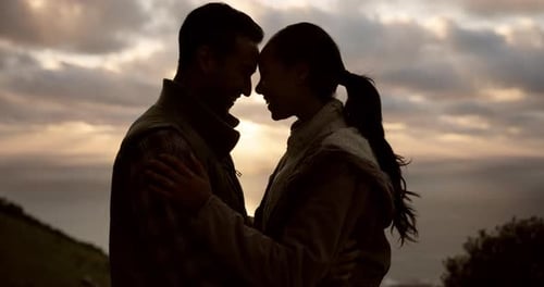 Romantic Couple Embracing at Sunset