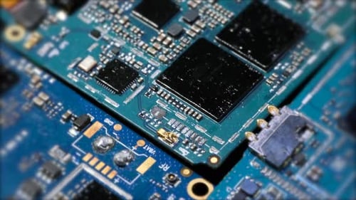 Microchips macro tracking shot, inside of electronic device computer motherboard components