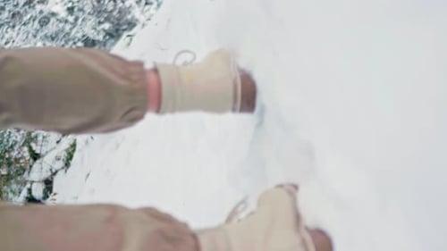 Woman Walks in Fresh Winter Snow